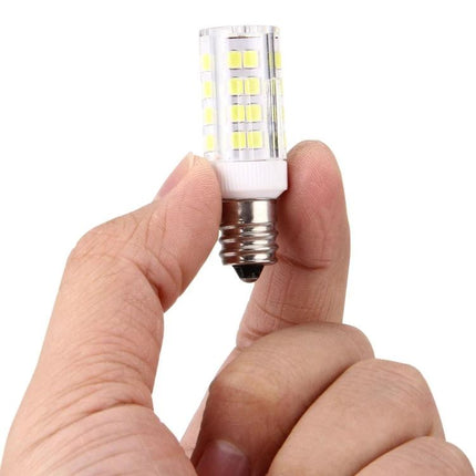 Essential LED Bulb for Home and Event Lighting held between fingers — compact E12 LED corn bulb for reading and small gatherings