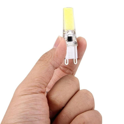 Silicone Dimmable Light for Everyday Home and Office Spaces - hand holding compact G4 silicone dimmable LED bulb for reading and work
