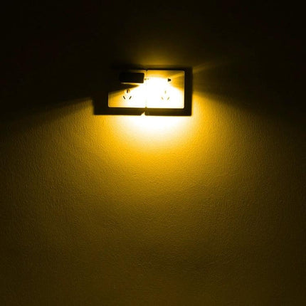 USB LED Book Light for Evening Reading and Travel clipped to a book and powered from a USB outlet for bedside or travel reading