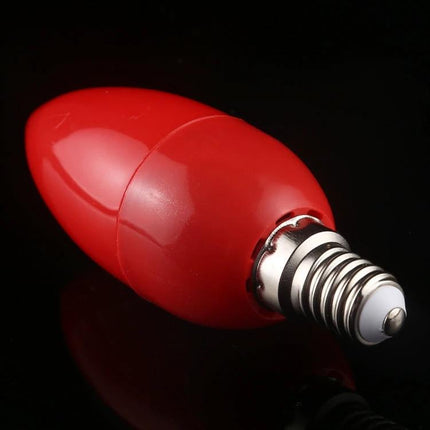A Practical LED Bulb for Illuminating Home Spaces Daily red candle-shaped LED bulb with E12 screw base on black background