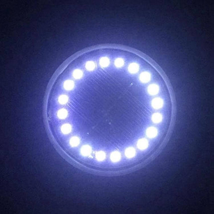 2 Pack Solar Underground Garden Lights For Walkways — round flush LED ground light glowing white in a dark garden to mark path edges and walkways