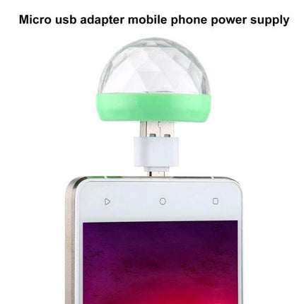 RGB USB LED Crystal Ball Stage Light For Parties And Clubs plugged into smartphone micro USB showing green-base crystal lampshade syncing colors to music
