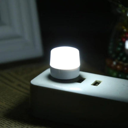 Essential USB Night Light for Bedside and Travel Use - compact USB-powered bedside nightlight emitting soft cool white glow for reading and travel