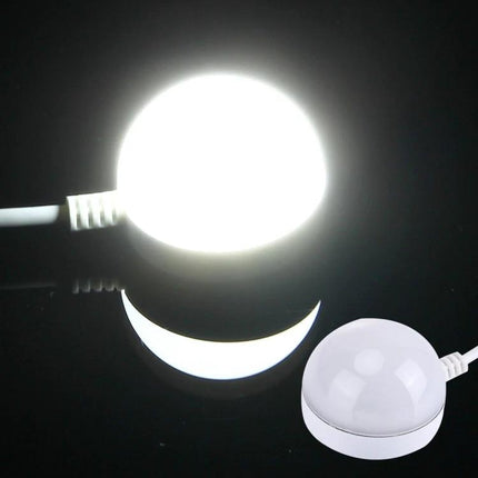 Compact USB Light for Travel and Daily Illumination Needs - compact round USB lamp with magnetic base plugged into power source