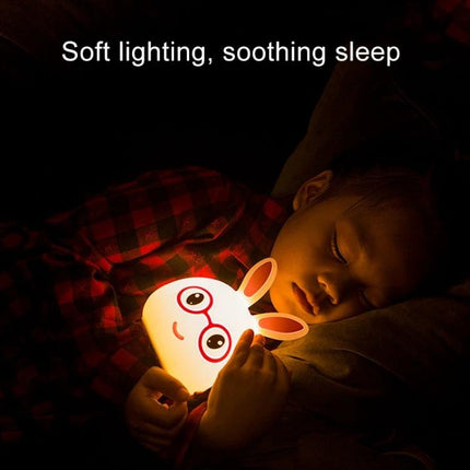 Charming Rabbit Inspired Lamp for Daily Evening Routines cuddled by a child on a nightstand providing soft, soothing reading light