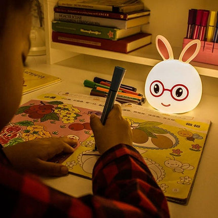 Charming Rabbit Inspired Lamp for Daily Evening Routines on nightstand casting gentle reading light beside child coloring book