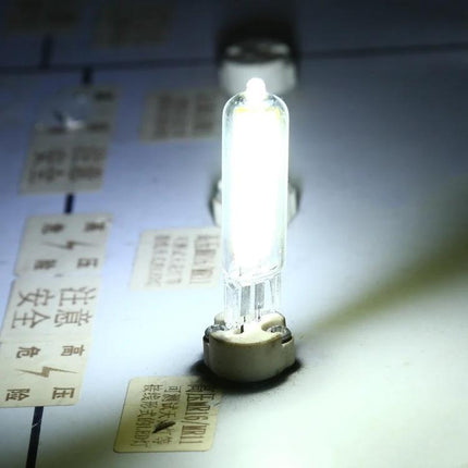 Dimmable LED Bulb for Your Daily Home Lighting Needs glowing small bulb in fixture creating adjustable home lighting ambiance