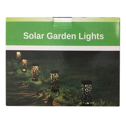 Outdoor Hollowing Out Solar Energy Garden Lawn Lamp For Pathways glowing along a garden path at night, hollow decorative solar lawn lights