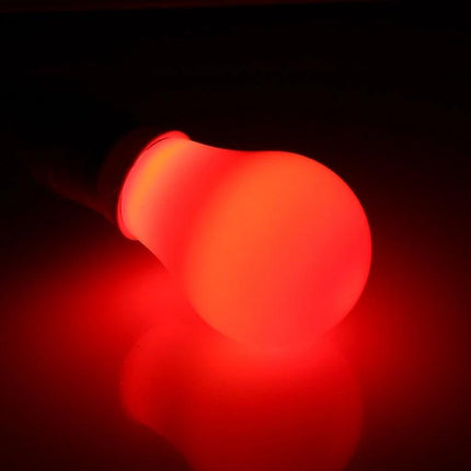 Red LED Bulb for Everyday Home and Office Lighting glowing on surface, eco-friendly red LED creating cozy living room and office ambiance