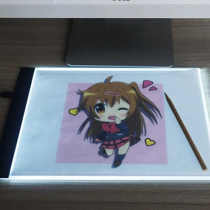 A4 Portable USB LED Tracing Light Box for Art and Design showing illuminated A4 tracer with anime sketch and pencil, slim 3mm USB-powered LED pad