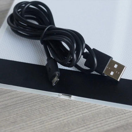 A4 Portable USB LED Tracing Light Box for Art and Design showing slim 3mm panel and USB cable with micro-USB connector for portable powering