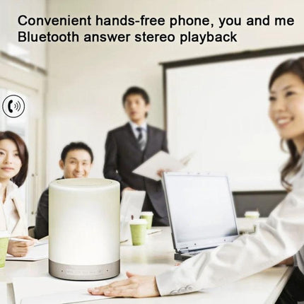 Versatile Speaker for Everyday Music and Travel Moments on conference table, portable handle, Bluetooth calls and stereo playback