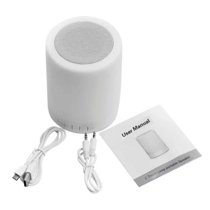 Versatile Speaker for Everyday Music and Travel Moments — compact white portable speaker with handle, charging cable, aux cable and user manual