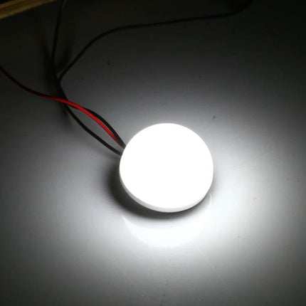 Semi-Circular LED Bulbs for Daily Home Illumination glowing compact bulb on desk with USB wires, low-energy task lighting for kitchen or closet