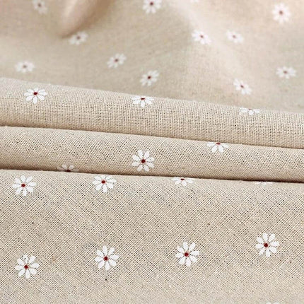 Lace Tablecloth For Dining And Events In Linen Blend beige linen with small white daisy embroidery and delicate lace-trimmed texture