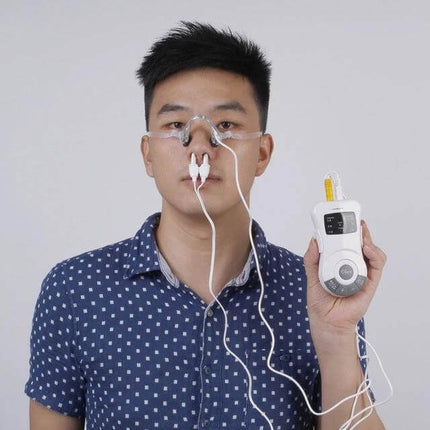 Laser Rhinitis Treatment Instrument for Allergy Relief shown held by a man using nasal probe for portable at-home allergy relief