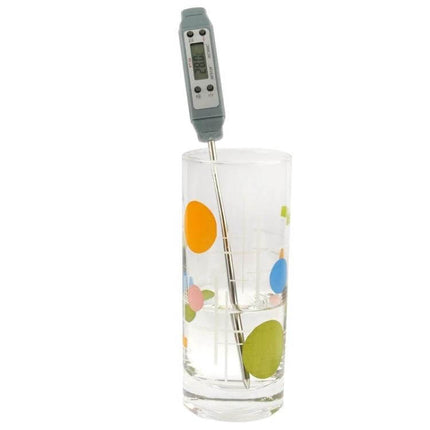 LCD Digital Food Thermometer for Everyday Home Cooking inserted in glass to show probe depth and clear LCD readout