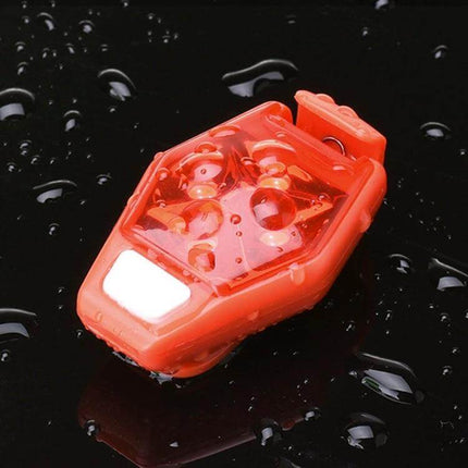 LED Back Clip Light For Outdoor Cycling And Running, Black - red four-LED waterproof clip light on wet surface for night cycling and running