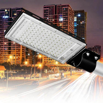 LED Outdoor Floodlight for Courtyard and Garden Use 50W or 100W mounted on pole illuminating driveway and urban courtyard at night