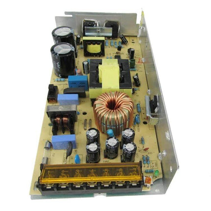 LED Strip Light Power Supply With Iron Housing For Everyday Use shown open circuit board with metal housing, capacitors and coil