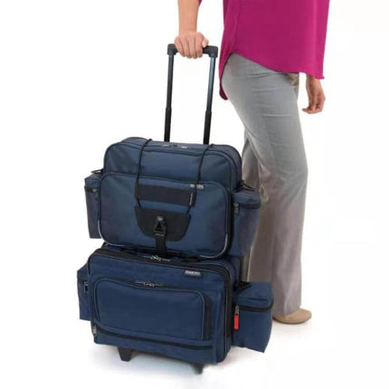 Traveler using Lever Box Packing Belt For Luggage, Adjustable Strap to secure two stacked navy suitcases and prevent shifting