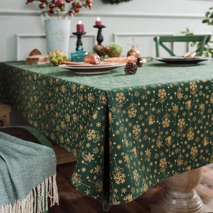 Linen Cotton Christmas Tablecloth Rectangular 140x300 cm on a green printed festive table with candles and holiday place settings