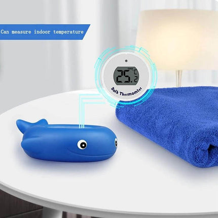Little Fish Baby Bath Thermometer Two Pack For Tub And Pool blue whale bath thermometer with digital display on table next to towel