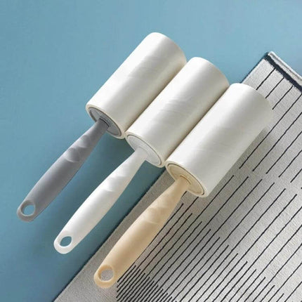 Long-Handle Sticky Roller for Clothing Pilling Removal, 22 cm showing three tear-off sticky rollers with 22 cm handles on fabric