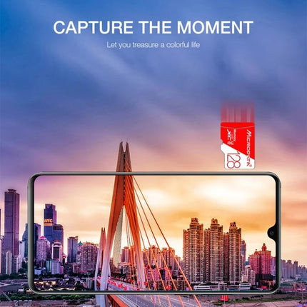 Microdata 32GB Micro SD Card for Storing Photos and Videos shown with smartphone capturing city skyline at sunset