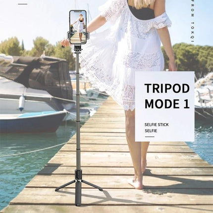 Foldable Tripod Selfie Stick for Daily Outings and Travel showing tripod mode on a dock with phone capturing a woman in a white dress