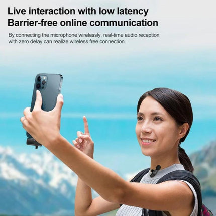 Compact Lavalier Microphone for Everyday Video Recordings worn by vlogger filming a selfie video outdoors with smartphone, wireless low-latency audio capture