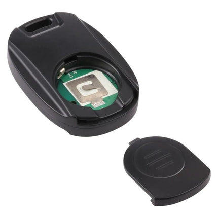 Compact Wireless Bluetooth One-Button Selfie Remote for Smartphones showing open battery compartment and cover