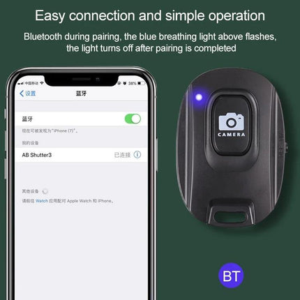 Compact Wireless Bluetooth One-Button Selfie Remote for Smartphones shown paired to iPhone with blue pairing LED and camera button