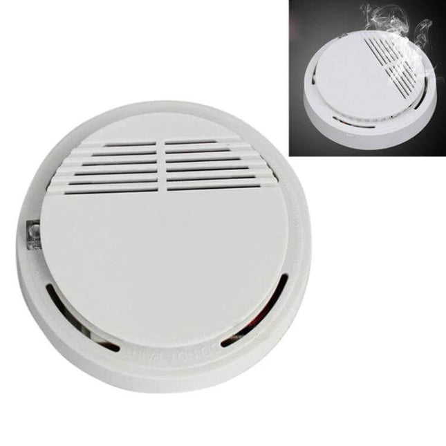 First Alert Battery-Operated Smoke Alarm for Home Safety white ceiling smoke detector showing vents and alarm indicator