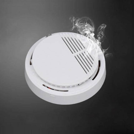 First Alert Battery-Operated Smoke Alarm for Home Safety mounted on ceiling with smoke detection and alarm indicators