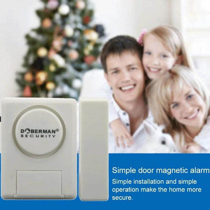 Doberman Wireless Remote Control Door Alarm for Home Security mounted on door with family in background, 100dB wireless entry alert for home protection