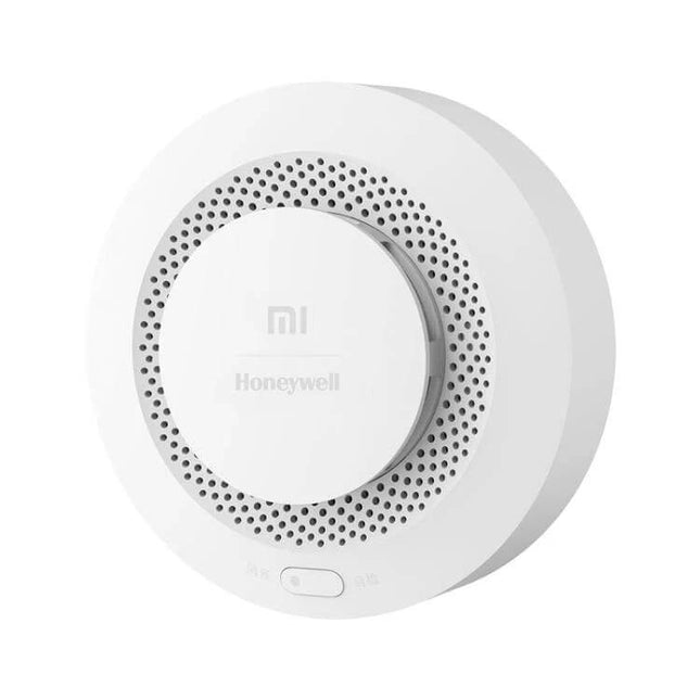 Xiaomi Honeywell Battery-Operated Smoke Detector for Home Safety white circular smoke and CO alarm mounted on wall