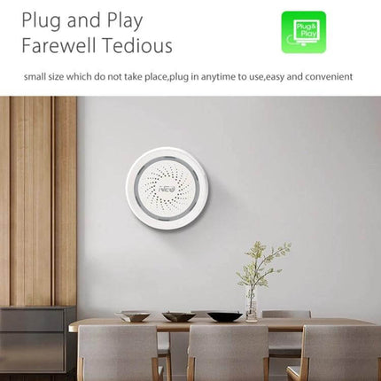 NEO Wireless WiFi USB Siren Alarm for Home Security mounted on living room wall near dining table, plug-and-play remote smartphone alerts