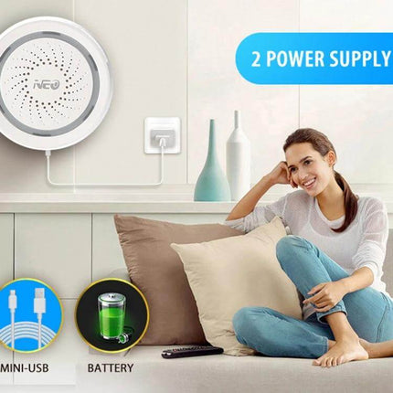 NEO Wireless WiFi USB Siren Alarm for Home Security mounted on wall with app control and woman relaxing on couch