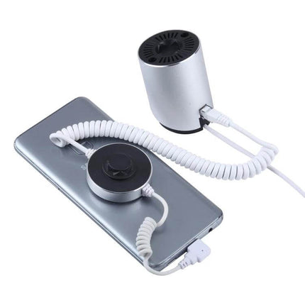 Cylindrical Display Stand for Mobile Phones with Anti-Theft Security showing phone on coiled tether and charging connection