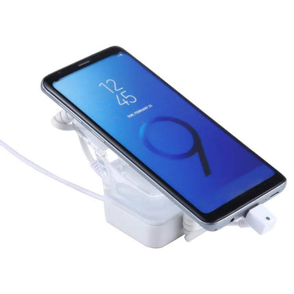 Anti-Theft Alarm Stand for Mobile Phones with Type-C Port displaying a demo phone connected and secured on retail counter