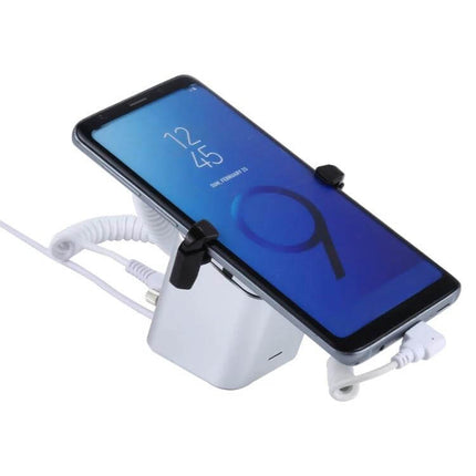 Aluminum Anti-Theft Display Stand for Mobile Phones with Type-C Port showing smartphone secured and charging on aluminum alloy retail stand