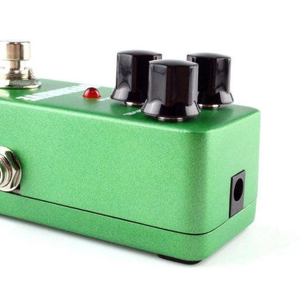 Add KOKKO Overdrive Pedal to Your Guitar for Daily Sessions green KOKKO overdrive pedal close-up with knobs and input jack