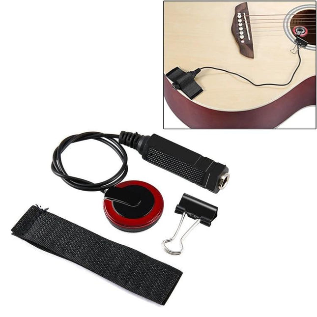 Pasteable Sound Pickup for Everyday Guitar Sessions stuck onto acoustic guitar with cable, clip and strap for quick amplification