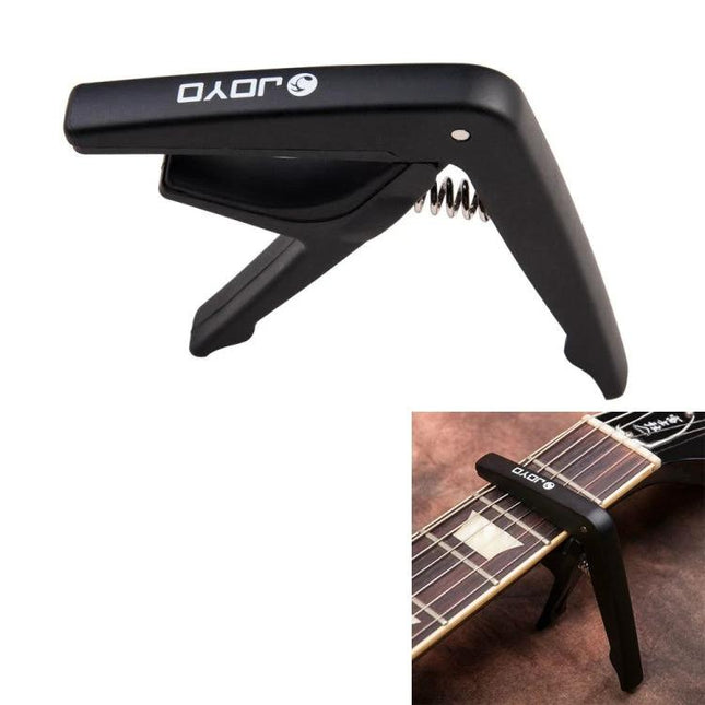 JOYO Guitar Capo for Everyday Music Practice and Travel black spring-loaded capo on acoustic guitar neck