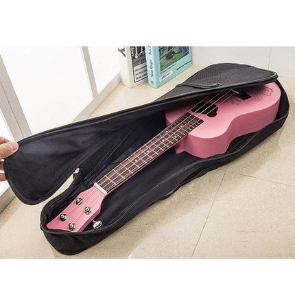 A Ukulele Backpack for Everyday Music and Travel Use with pink soprano ukulele in padded black case, adjustable strap for travel
