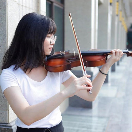 Full Size Handmade Acoustic Violin for Home Music Practice being played by a beginner practicing outside after work
