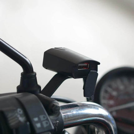 Waterproof USB Phone Charger Adapter for Motorcycle Use mounted on handlebar with USB port and weatherproof cover