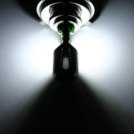 Motorcycle LED Headlight with White and Yellow Light Options — compact LED bulb shown emitting bright white beam for improved night and fog visibility