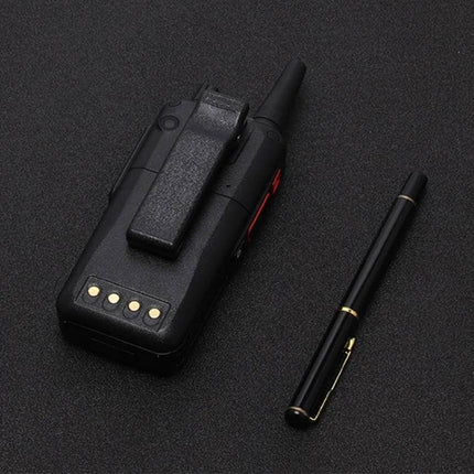 Durable Waterproof Smartphone for Everyday Outdoor Use rugged black outdoor phone with belt clip next to pen, waterproof and impact-resistant design